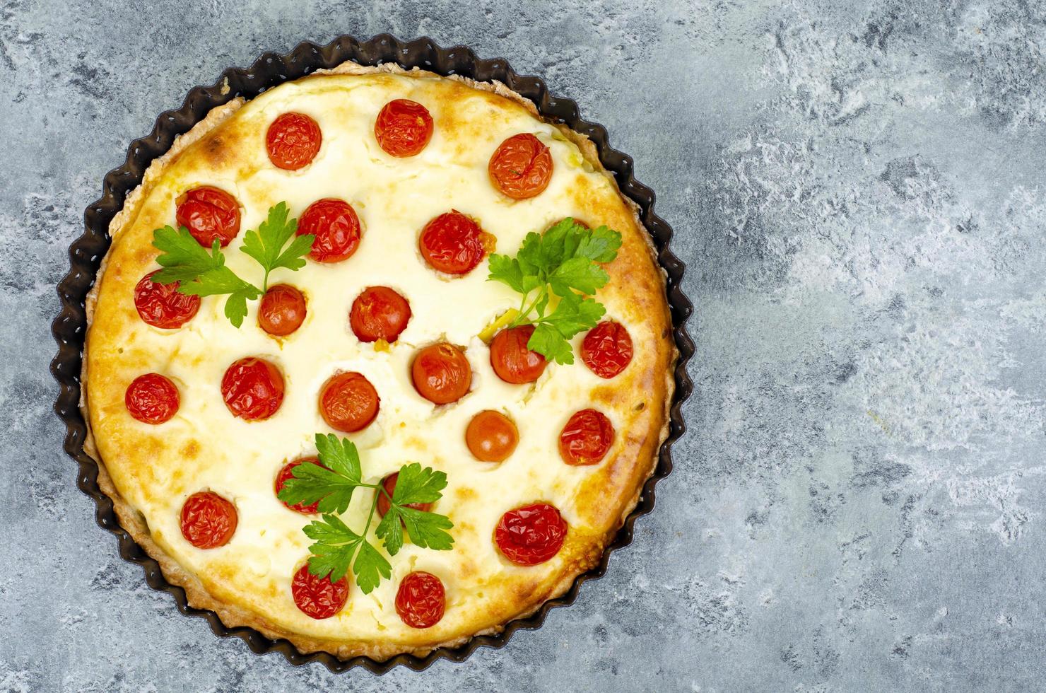 Homemade baking. Cherry tomato snack pie. Studio Photo. photo