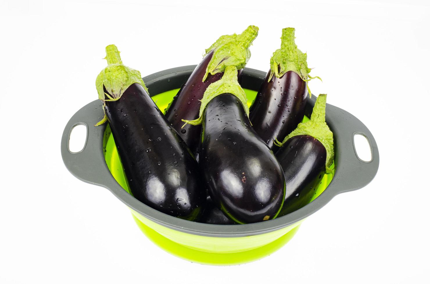 Clean washed eggplant for cooking in colander. Studio Photo. photo