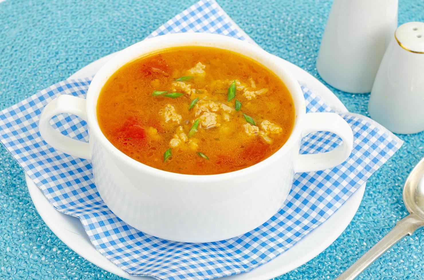 Thick homemade vegetable soup with rice, pumpkin and tomatoes photo