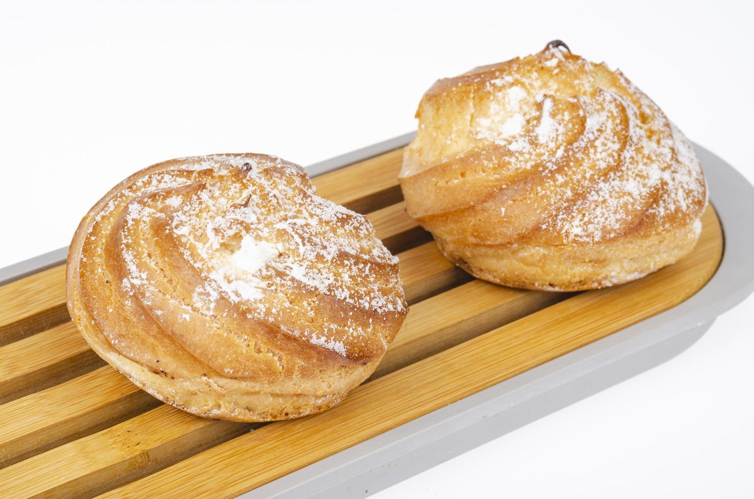 Fresh homemade cakes with cream and powdered sugar. Studio Photo