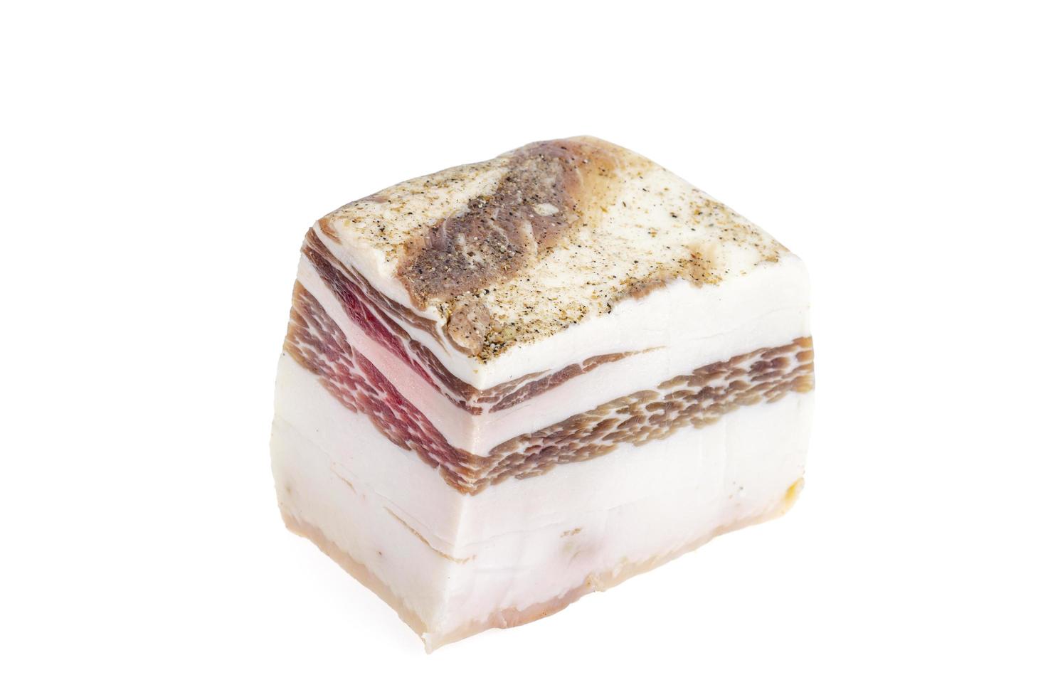 Piece of salted pork belly isolated on white background, lard. photo