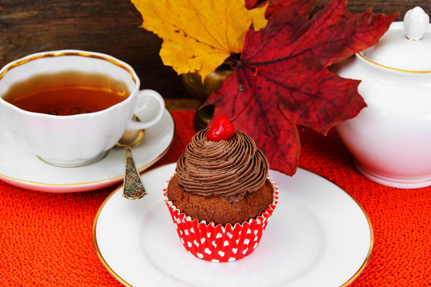 Cake with Cream, Cupcake on Wood Background. photo