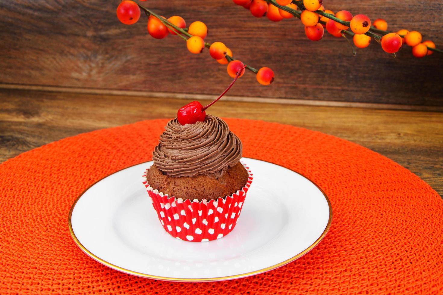 Cake with Cream, Cupcake on Wood Background. photo