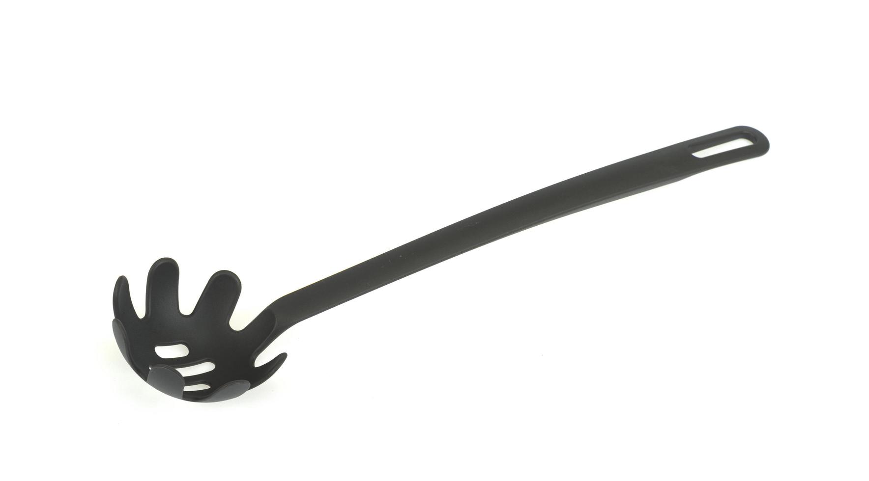 Plastic spoon with holes, kitchen gadget. Photo 4418678 Stock Photo at