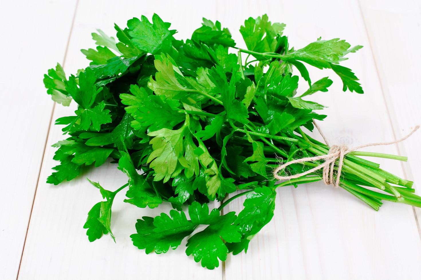 Fresh Parsley on a Wooden Boards photo