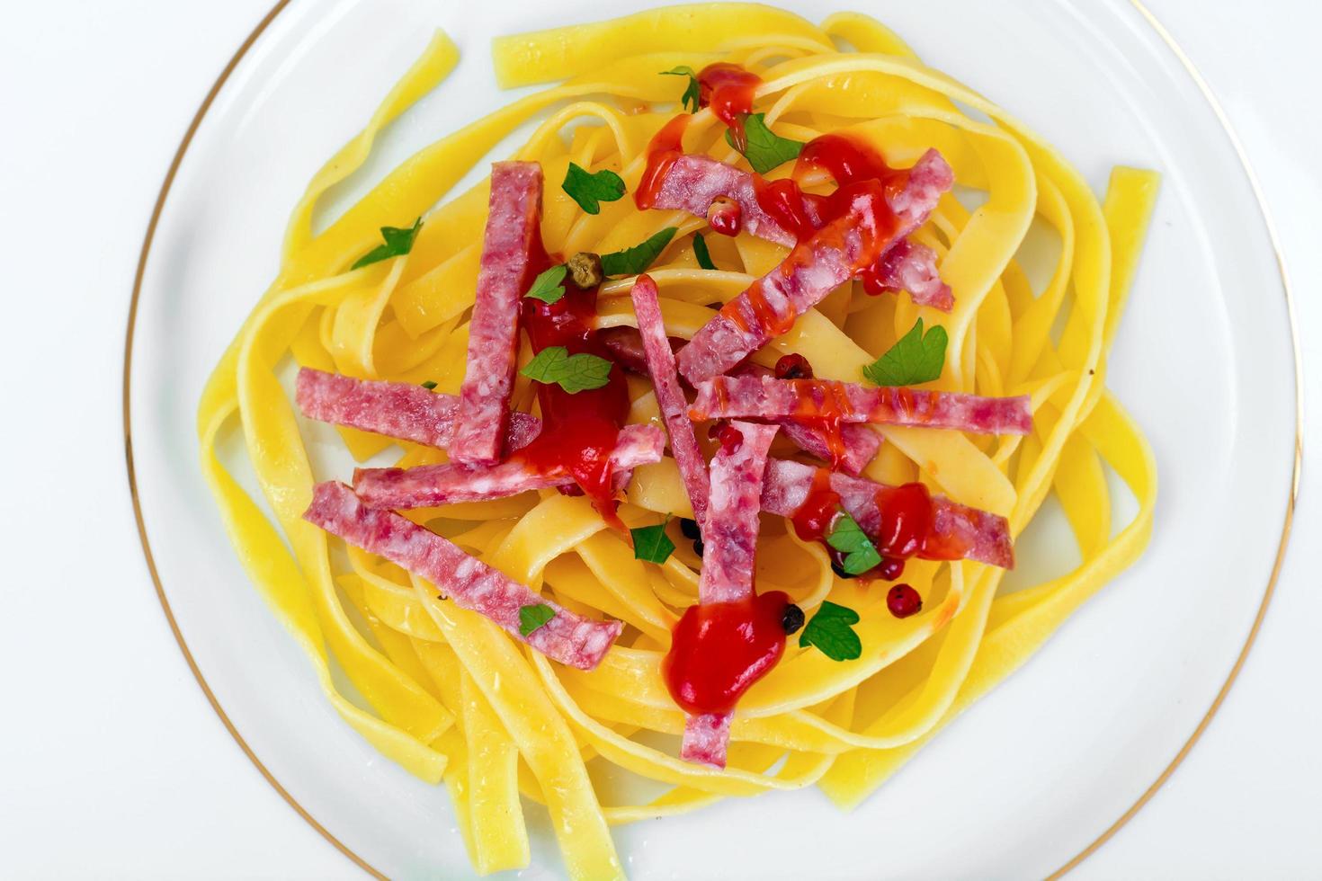 Italian Noodles, Pasta with Sausage, Salami and Ketchup photo