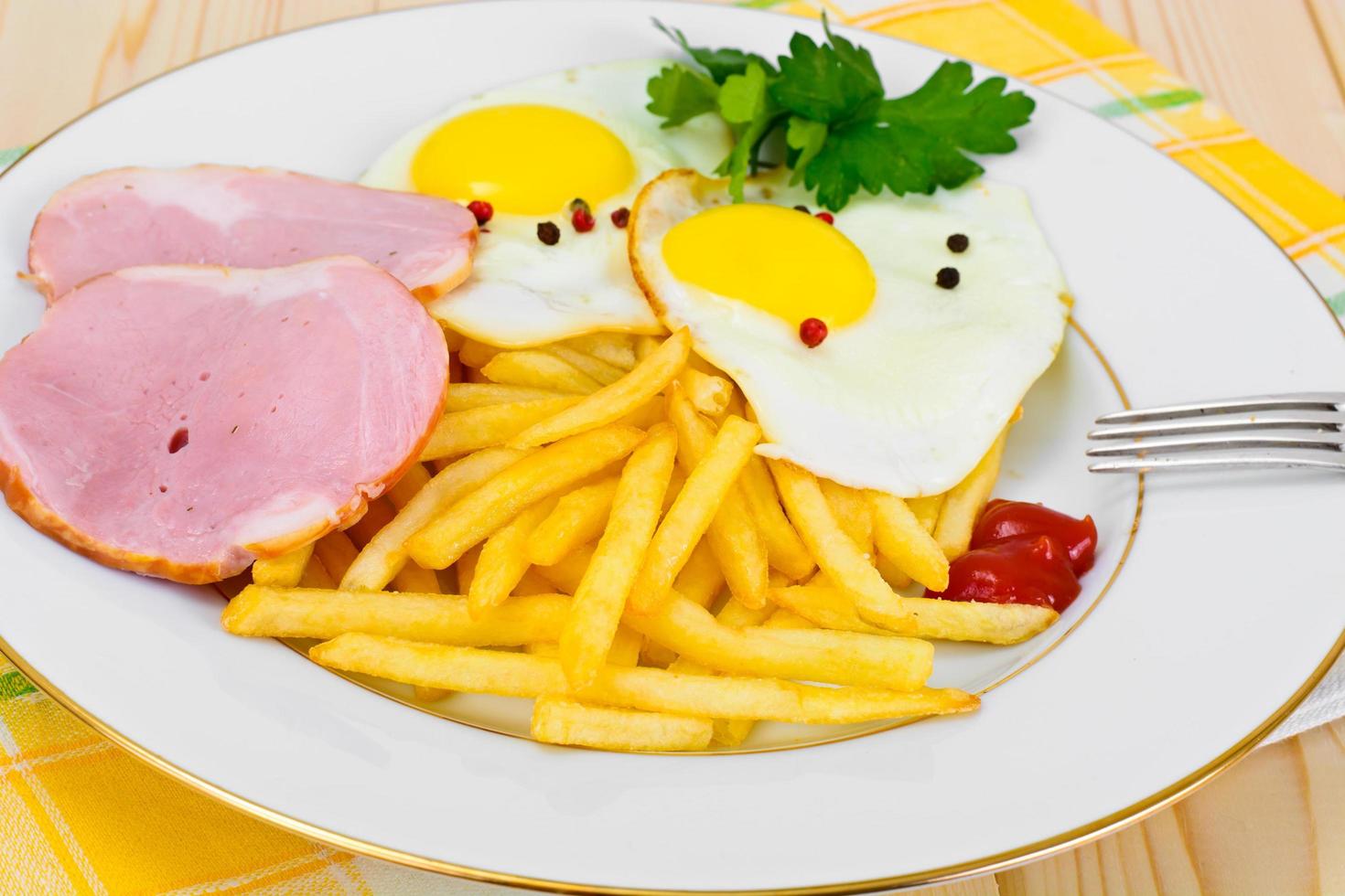 French Fries with Scrambled Eggs, Ham, Ketchup photo