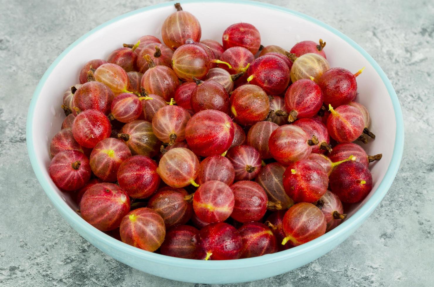 Ripe red sweet gooseberries, bio, gardening. Studio Photo