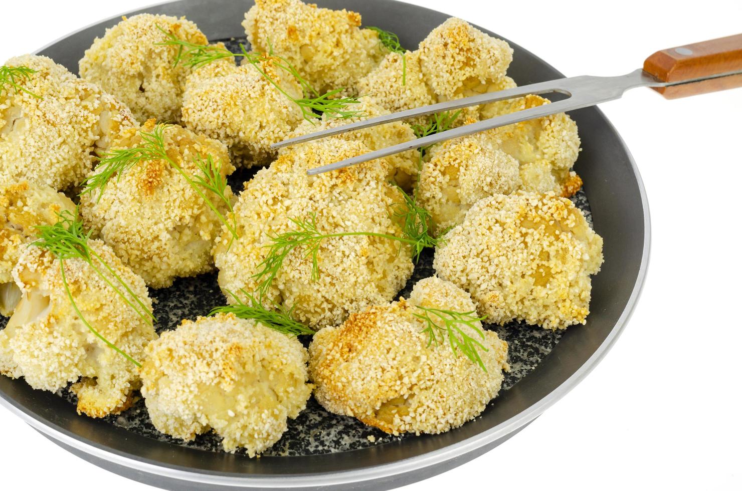 Cauliflower breaded in breadcrumbs in pan. Photo