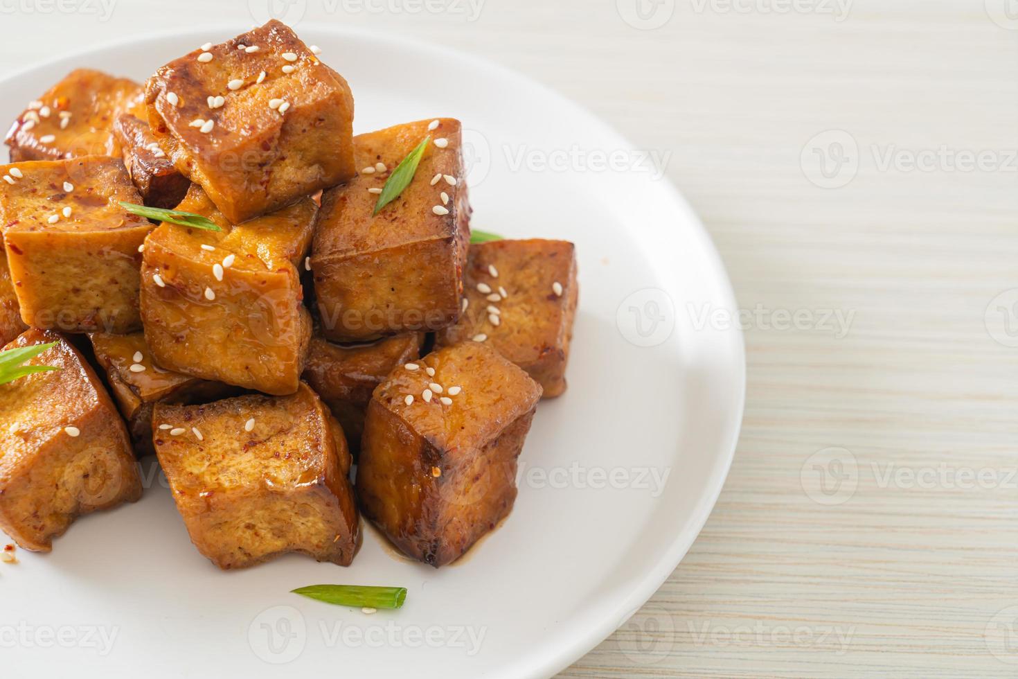 fried tofu with white sesame and teriyaki sauce photo