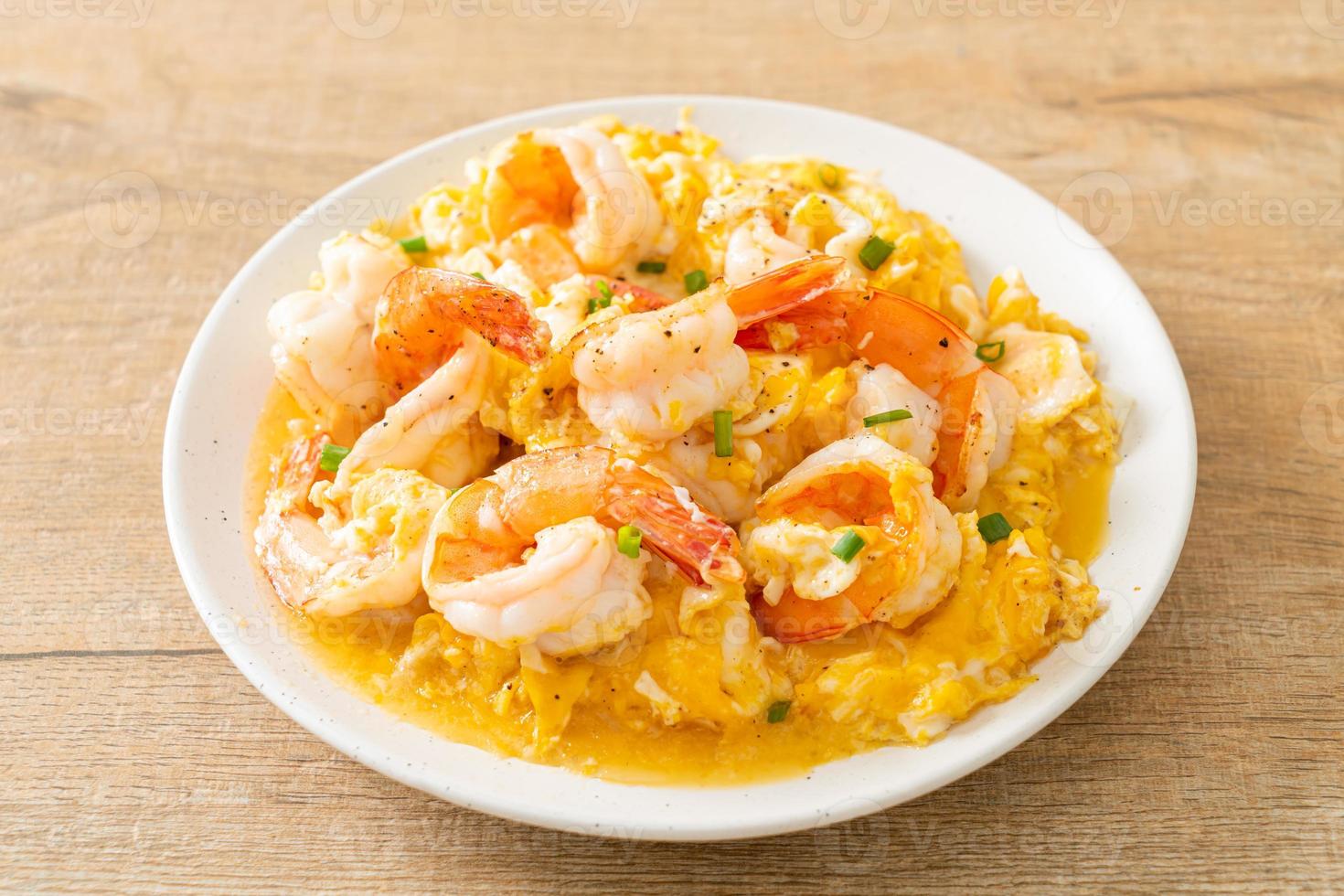 creamy omelet with shrimps or scrambled eggs and shrimps photo
