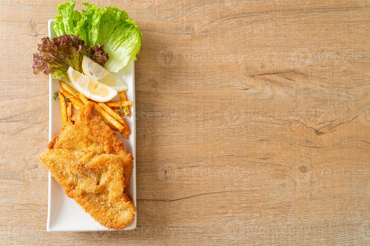 fish and chips - fried fish fillet with potatoes chips photo