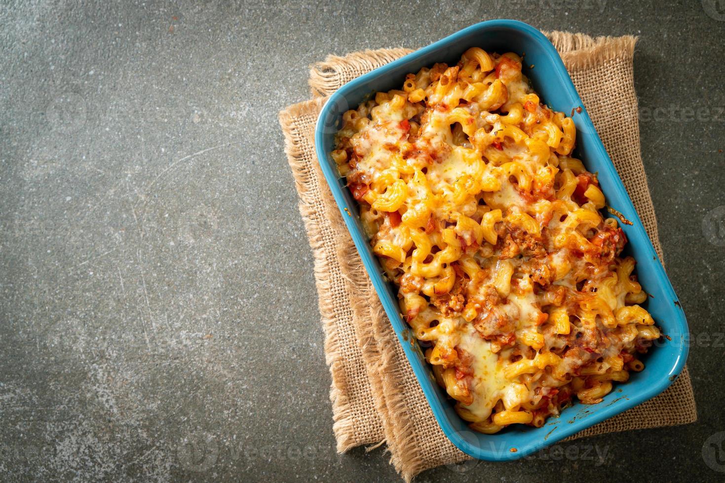 homemade macaroni bolognese with cheese photo