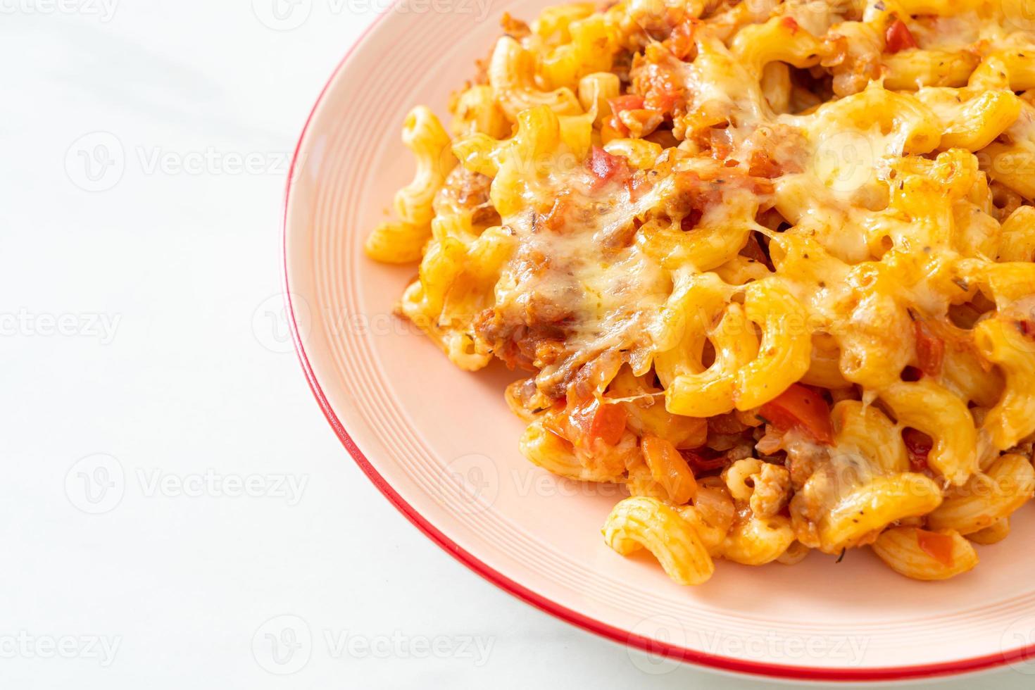 homemade macaroni bolognese with cheese photo