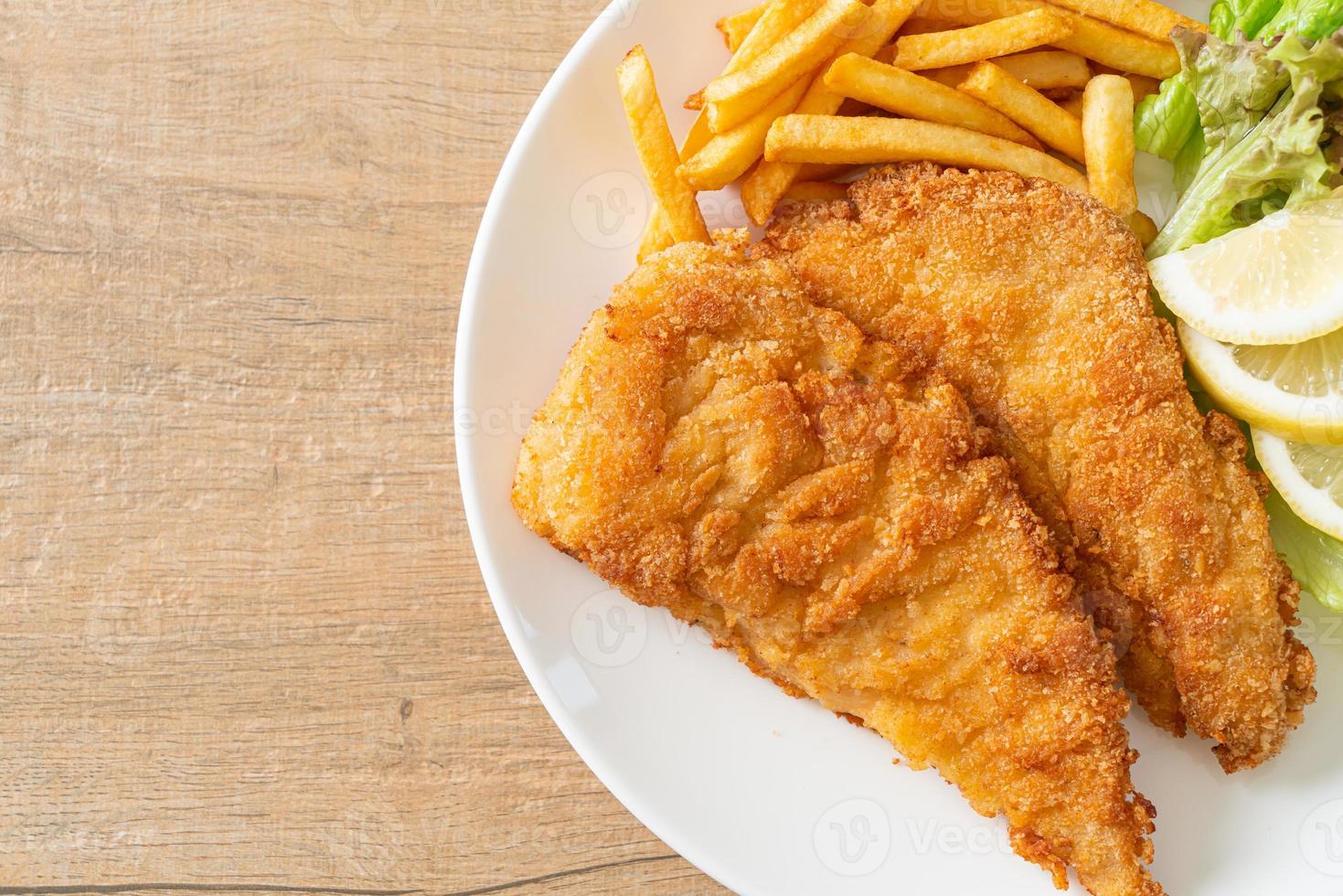 Homemade Breaded Weiner Schnitzel with Potato Chips photo