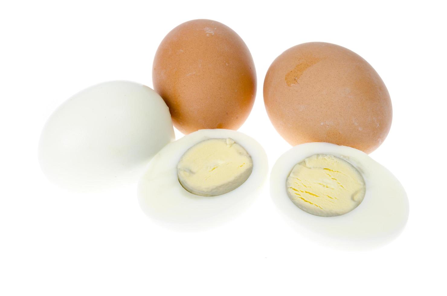 Boiled chicken eggs with colored shells on white background. photo