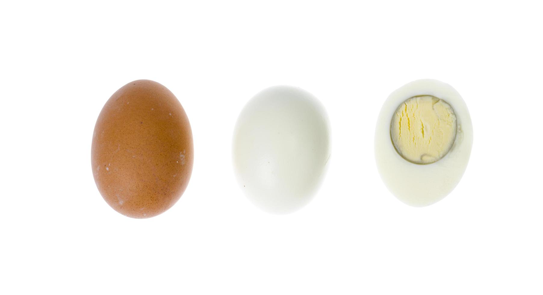 Boiled chicken eggs with colored shells on white background. photo