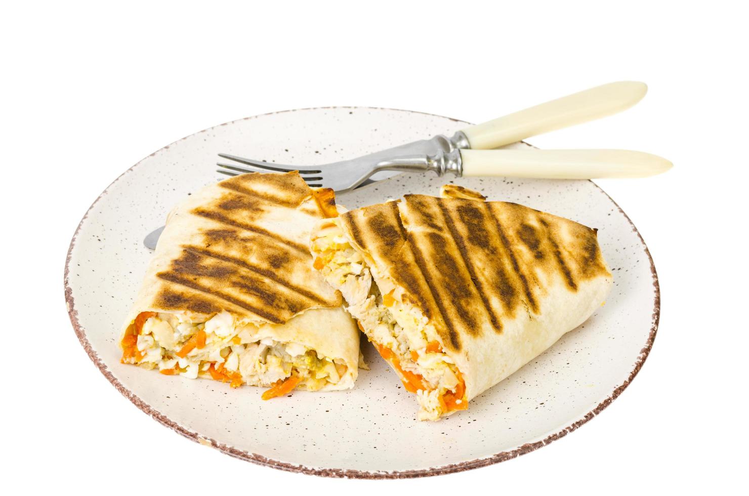 Shawarma, pita, tortilla with chicken and spicy carrots. photo