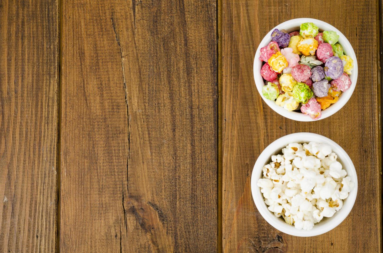 White bowls with different popcorn. Studio Photo