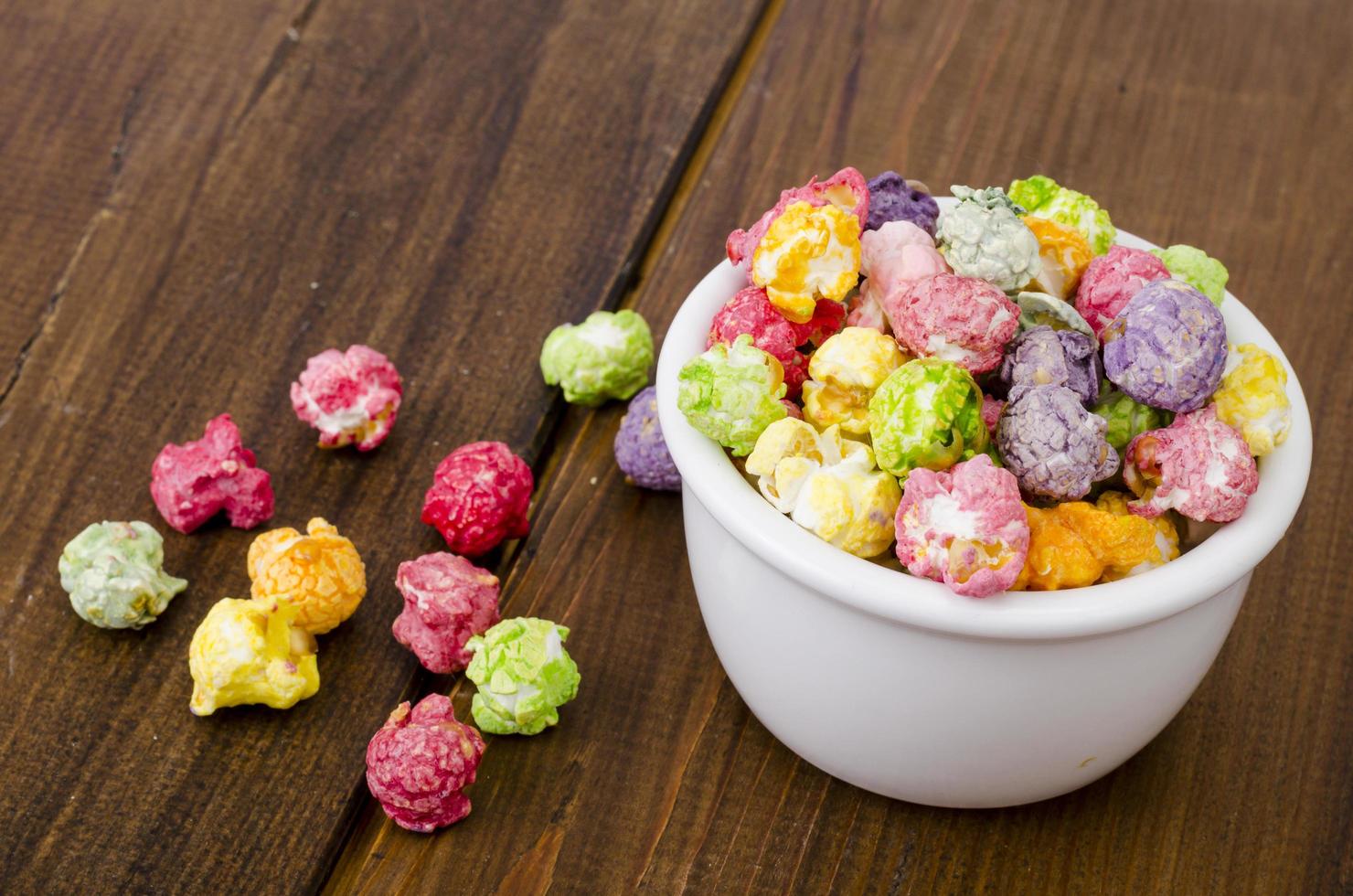 Sweet multicolor caramel Popcorn in white bow photo