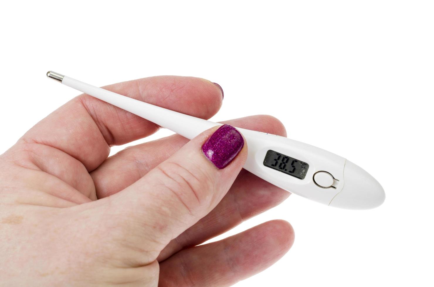Female hand with electronic thermometer isolated on white background photo