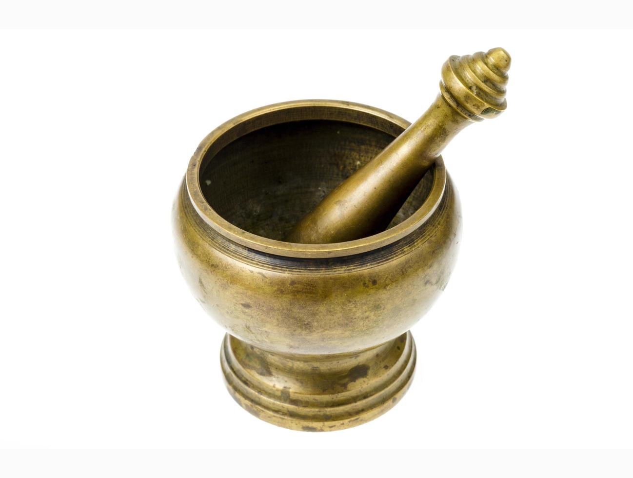 Antique copper mortar with pestle isolated on white background. photo