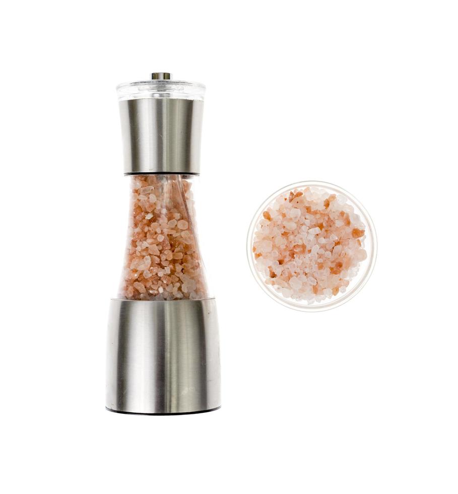 Sea salt in salt shaker, mill on white background. photo