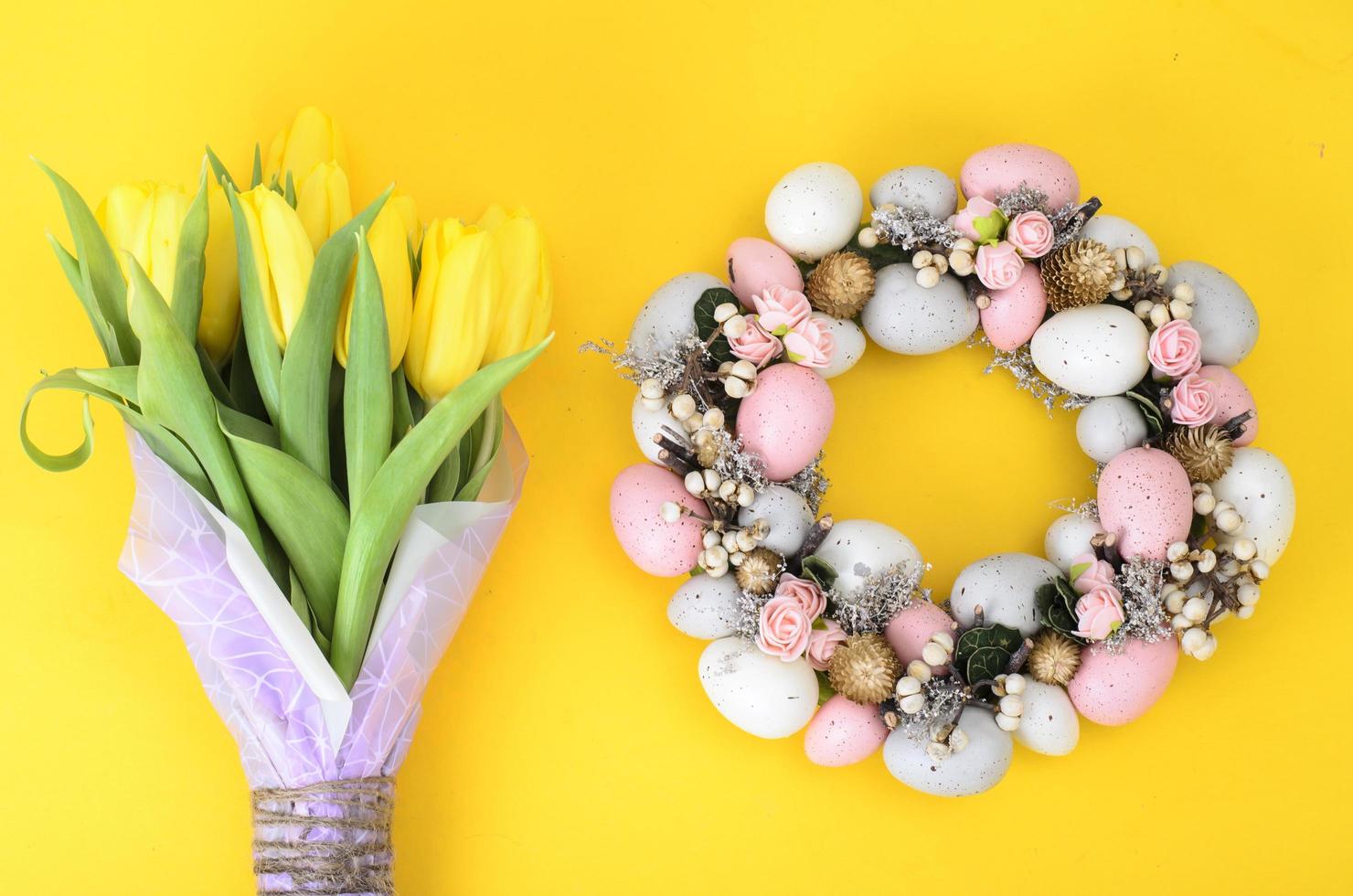 Easter wreath of colorful decorative eggs, flowers photo