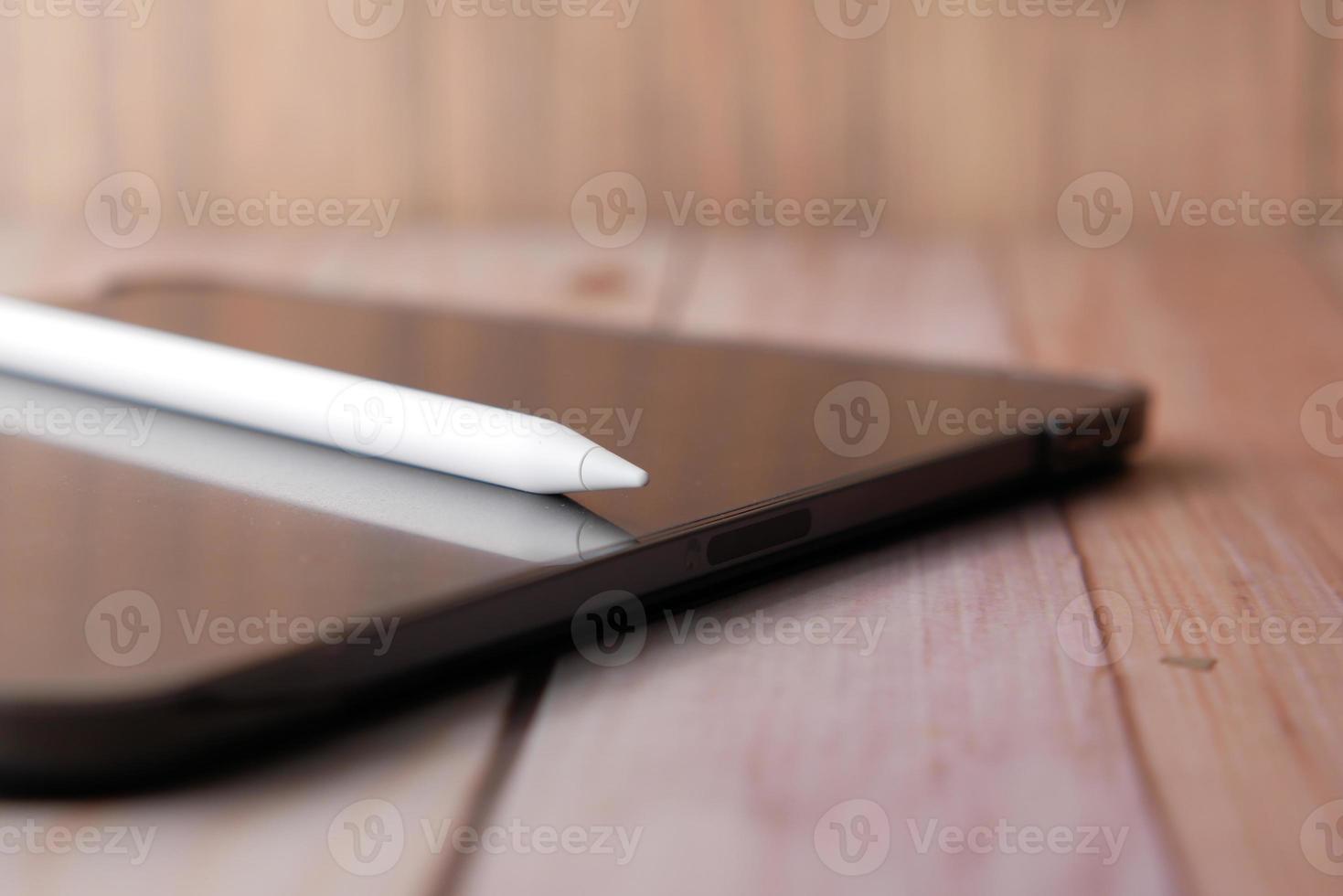 digital tablet and graphic on table photo