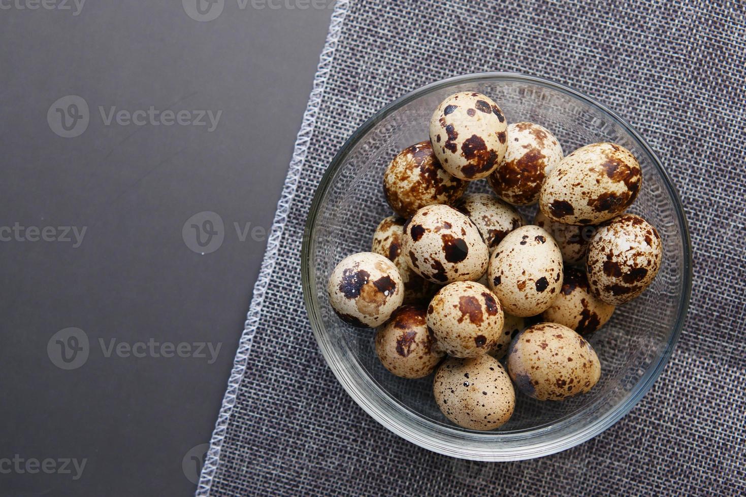 close up of Quails eggs in a box photo