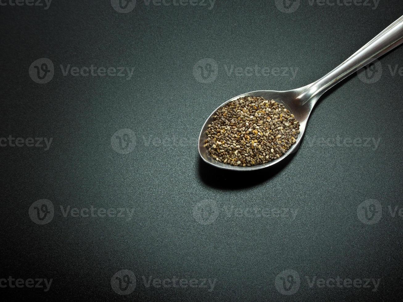 Chia seed on black background photo