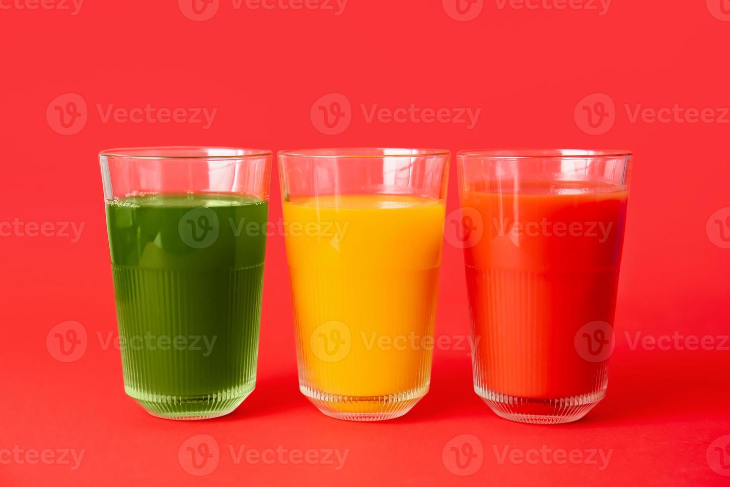 Different healthy juice on color background photo