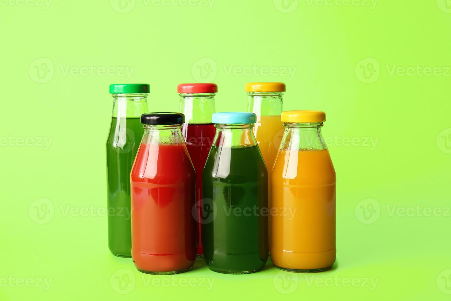 Different healthy juice on color background photo