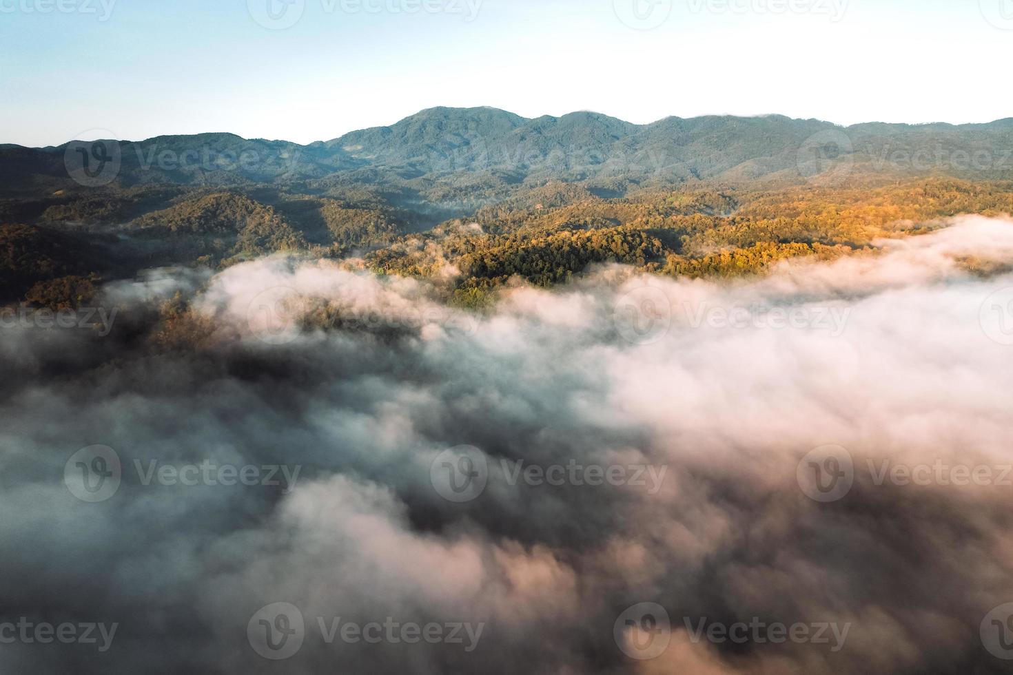 Flying above the clouds sunrise and fog photo