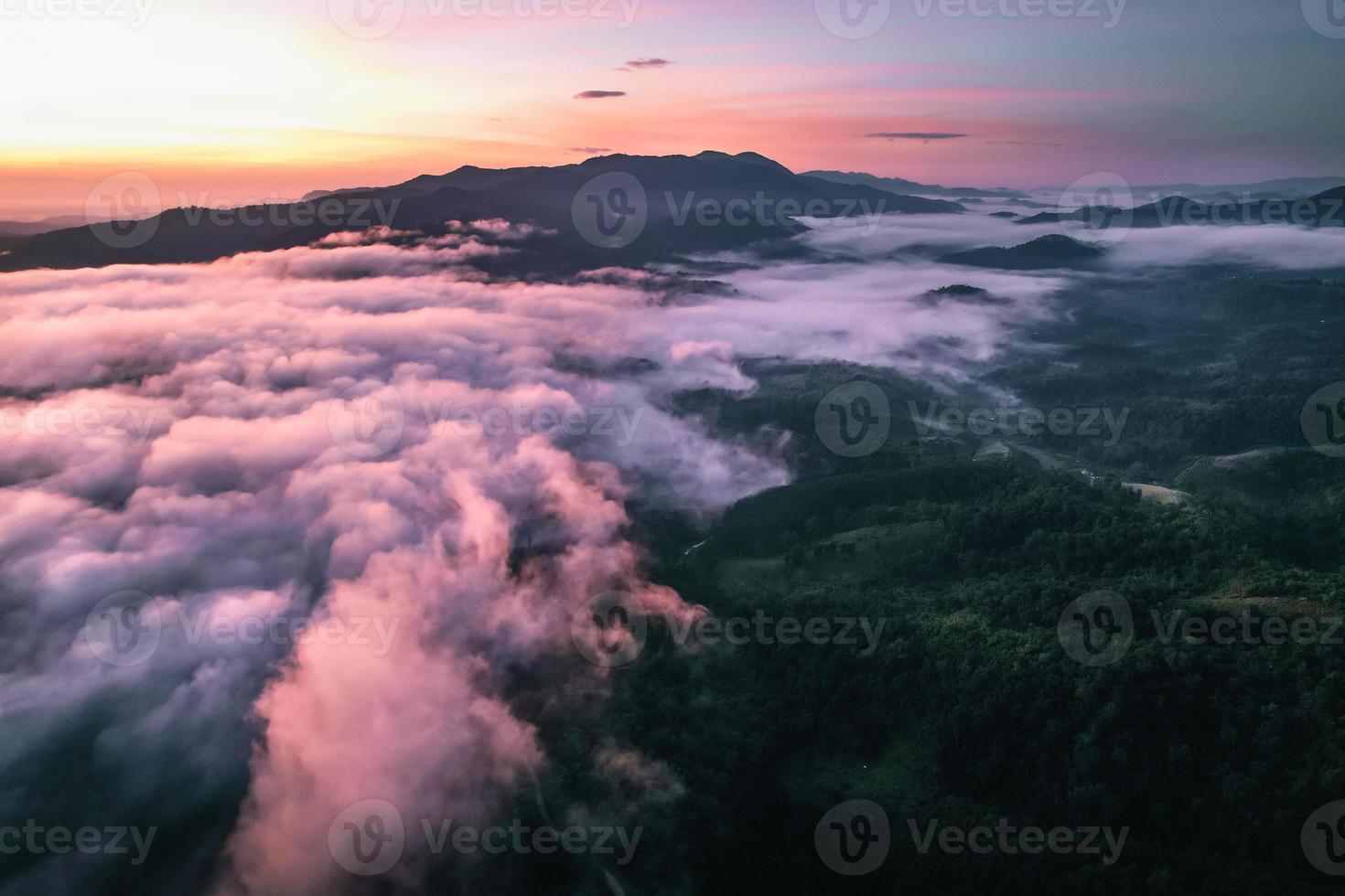 Flying above the clouds sunrise and fog photo