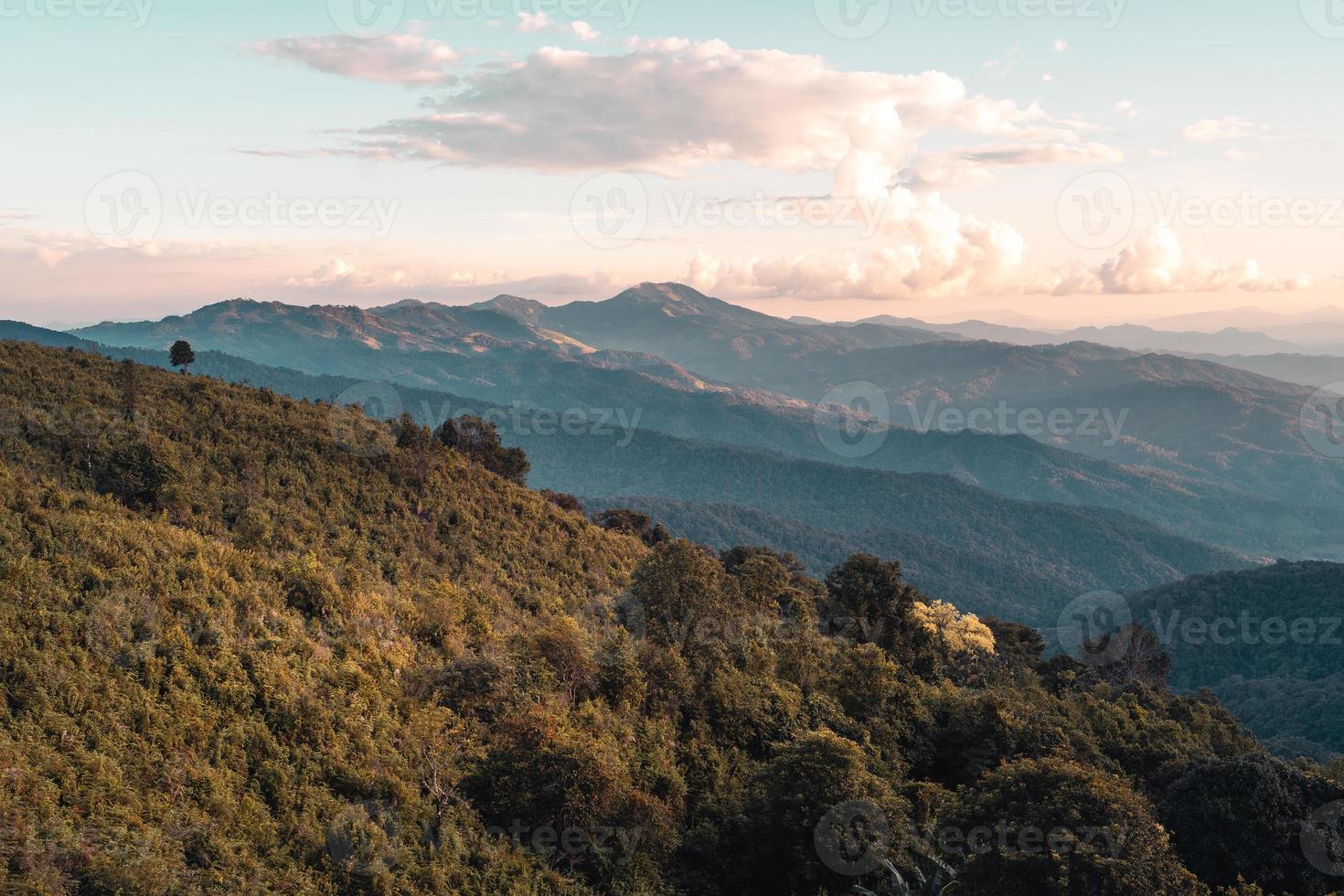 Scenic View Of Mountains Against Sky During Sunset photo