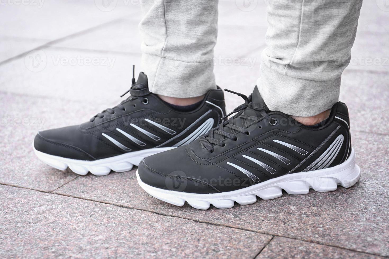 Stylish man in black casual shoes outdoors photo