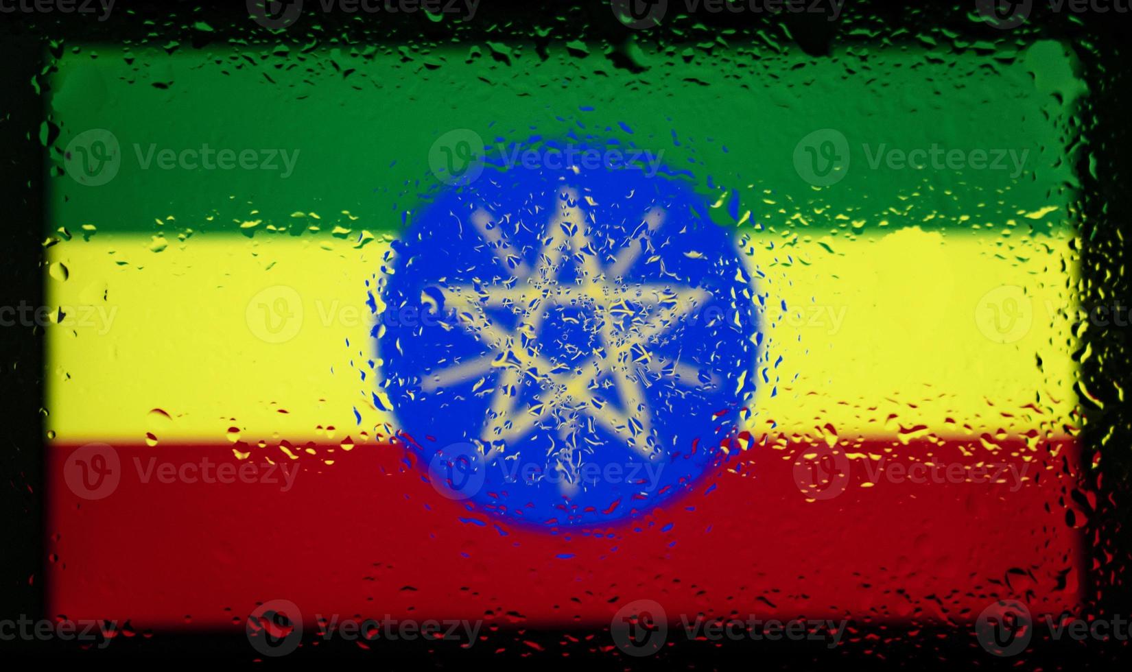 Drops of water on Ethiopia flag background. Shallow depth of field. Selective focus. Toned. photo