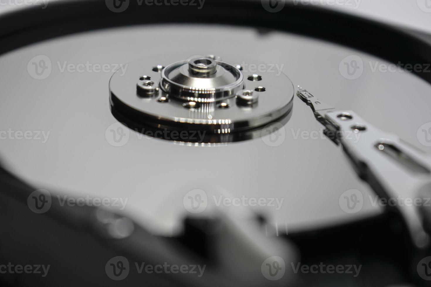 Hard drive from the computer hdd with mirror effect. Close-up, macro. photo