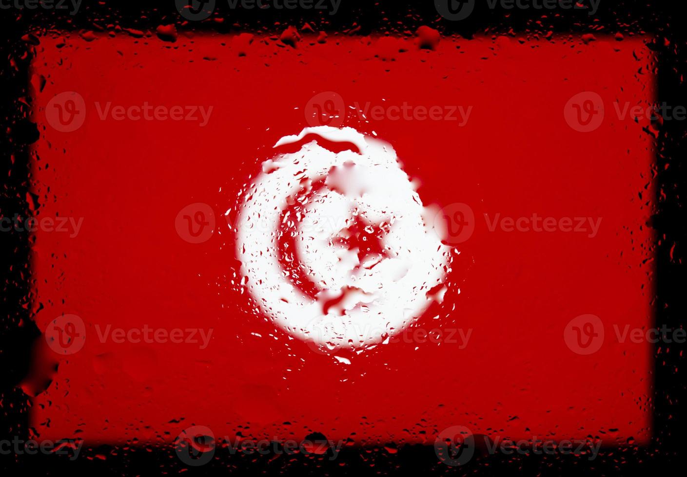 Drops of water on Tunisia flag background. Shallow depth of field. Selective focus. Toned. photo