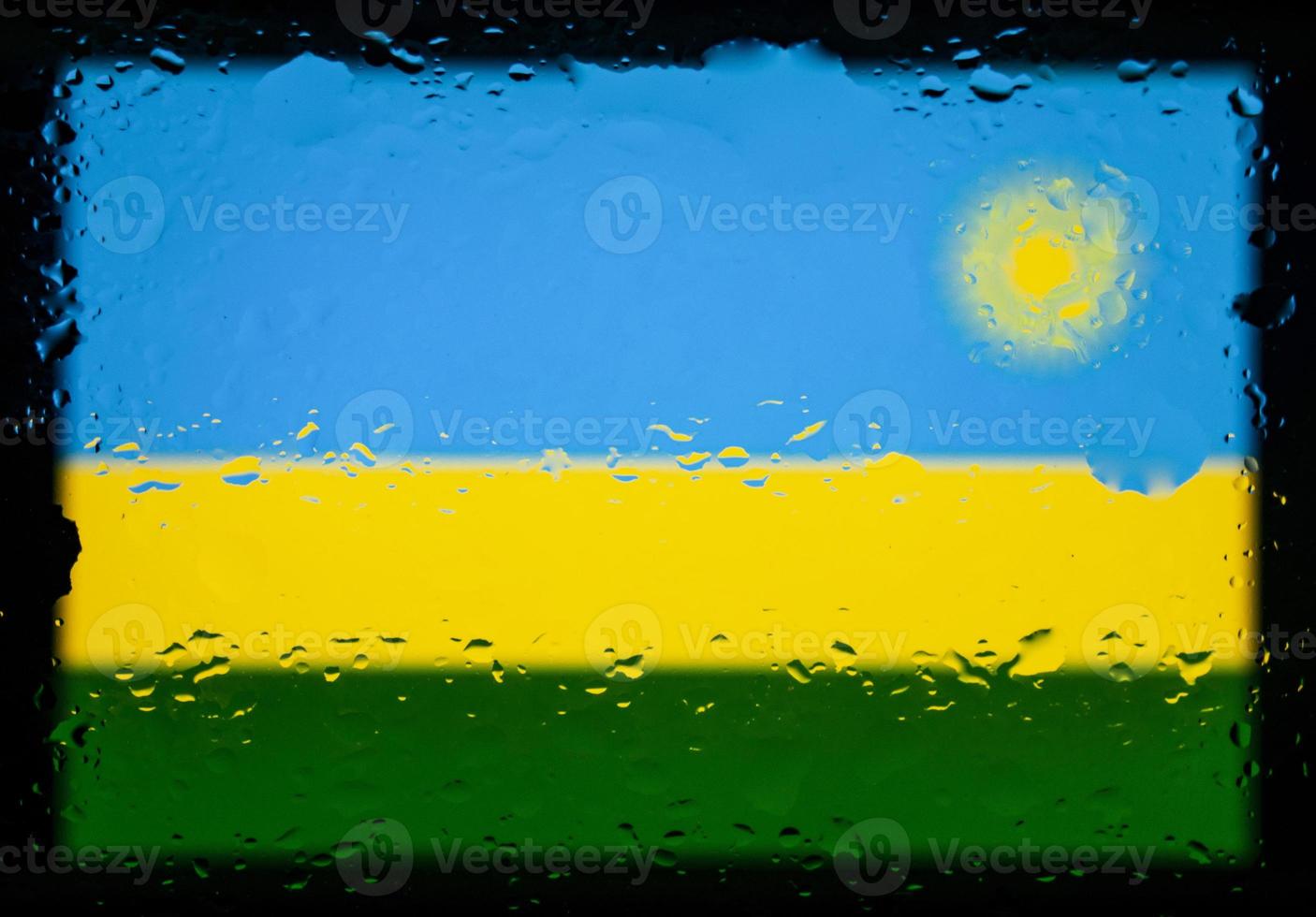 Drops of water on Rwanda flag background. Shallow depth of field. Selective focus. Toned. photo