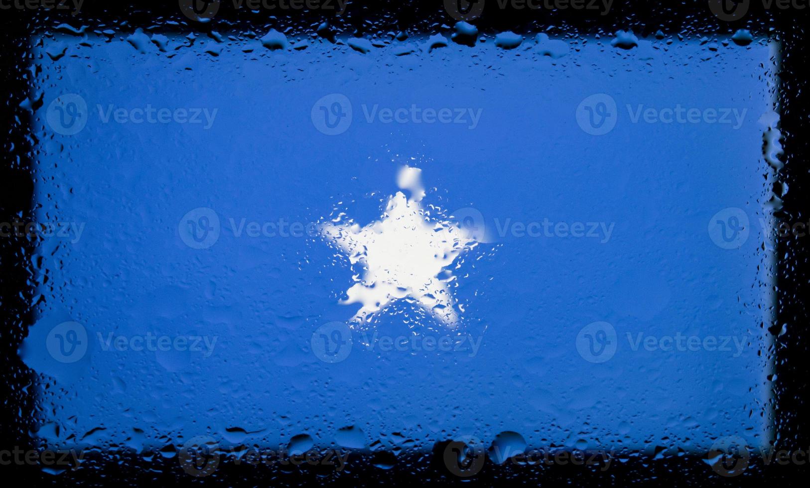 Drops of water on Somalia flag background. Shallow depth of field. Selective focus. Toned. photo
