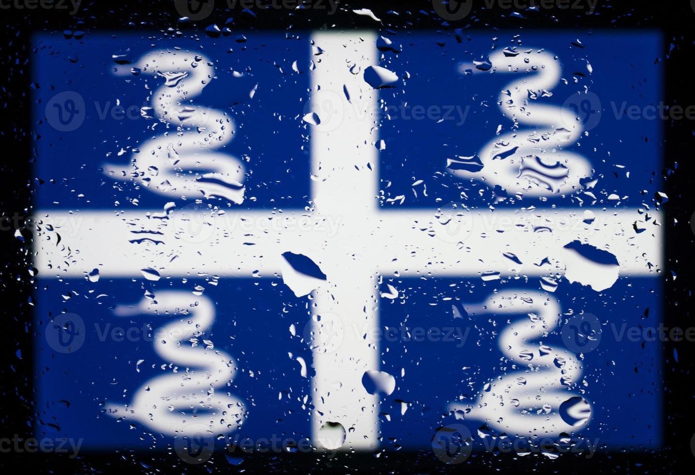 Drops of water on Martinique flag background. Shallow depth of field. Selective focus. Toned. photo