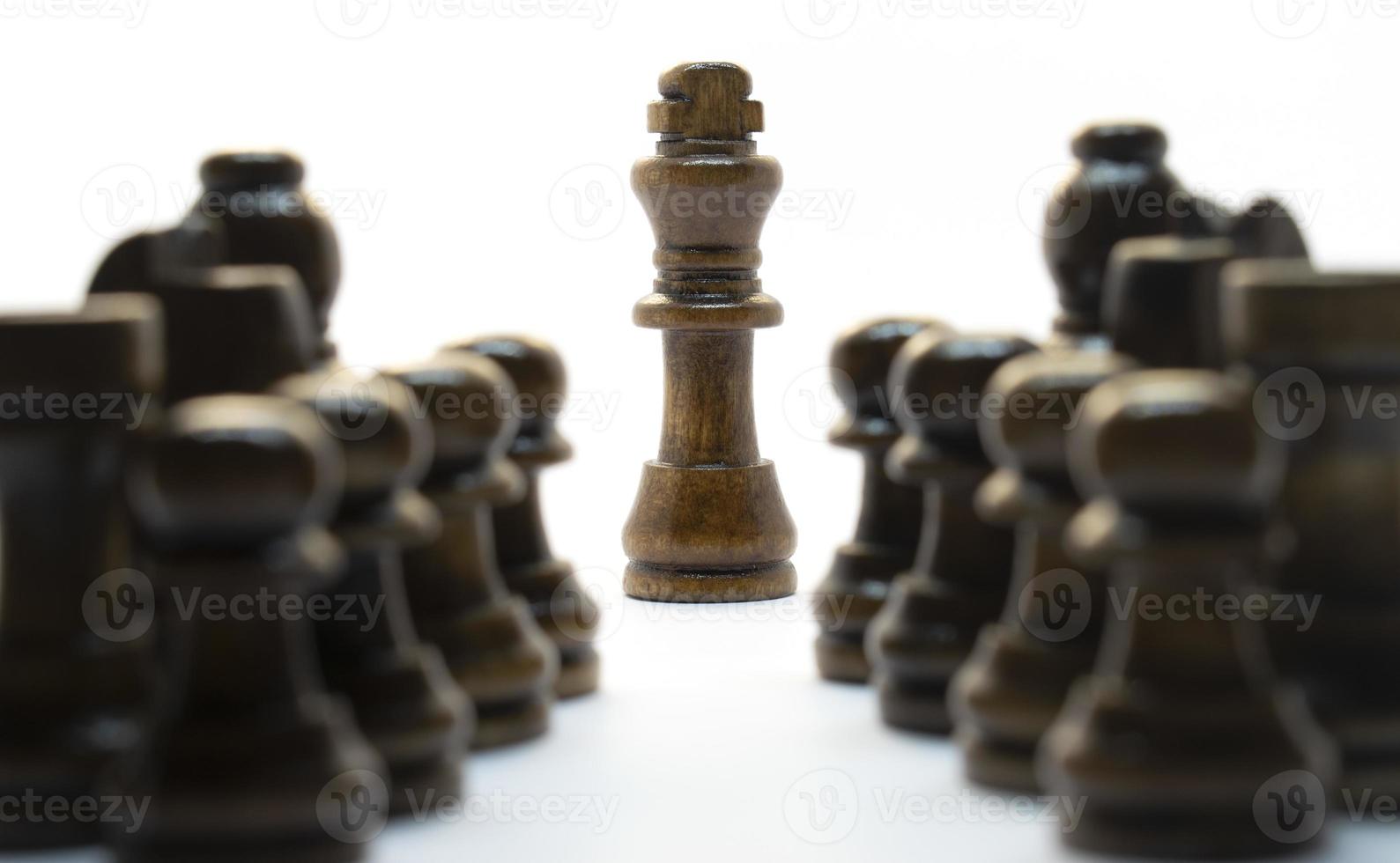 Simple wooden chess in a variety of positions. Isolated on white background photo