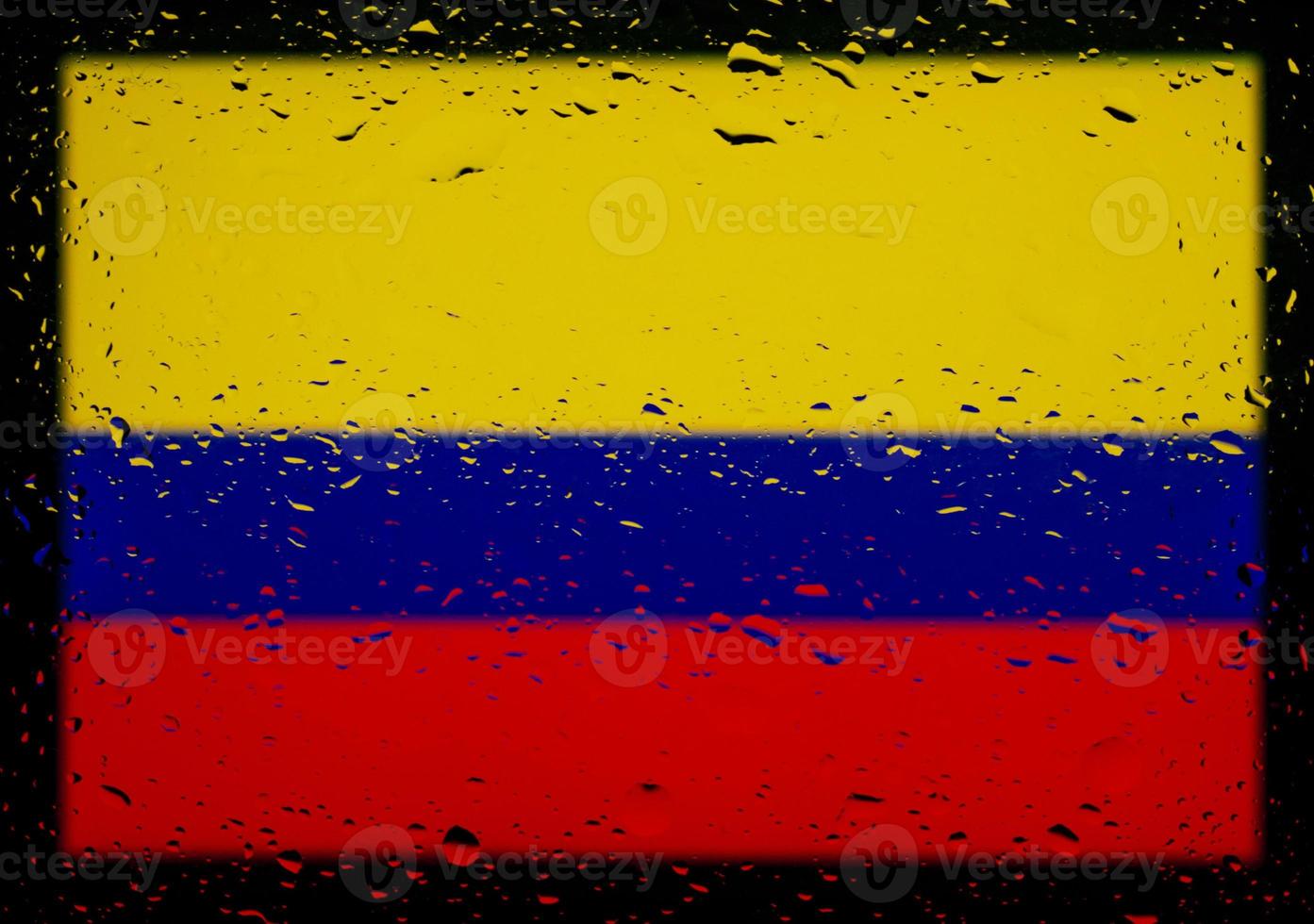 Drops of water on Colombia flag background. Shallow depth of field. Selective focus. Toned. photo