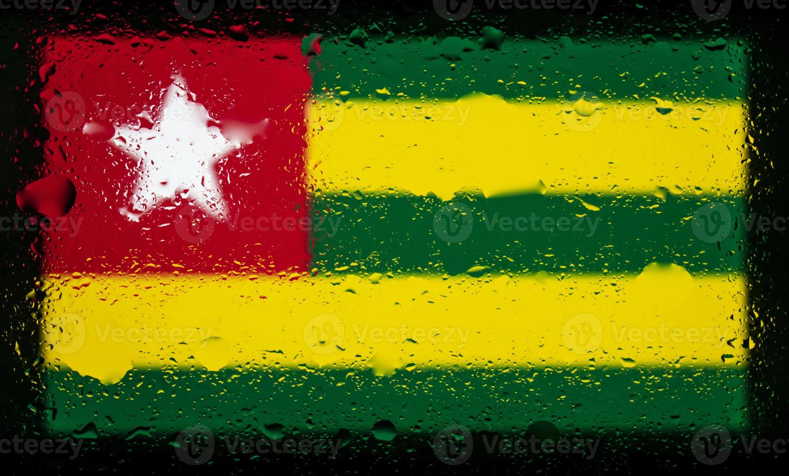 Drops of water on Togo flag background. Shallow depth of field. Selective focus. Toned. photo