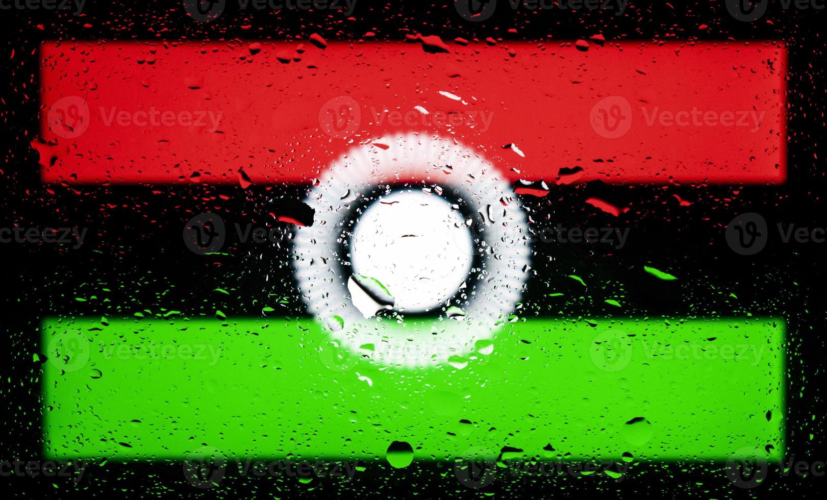 Drops of water on Malawi flag background. Shallow depth of field. Selective focus. Toned. photo
