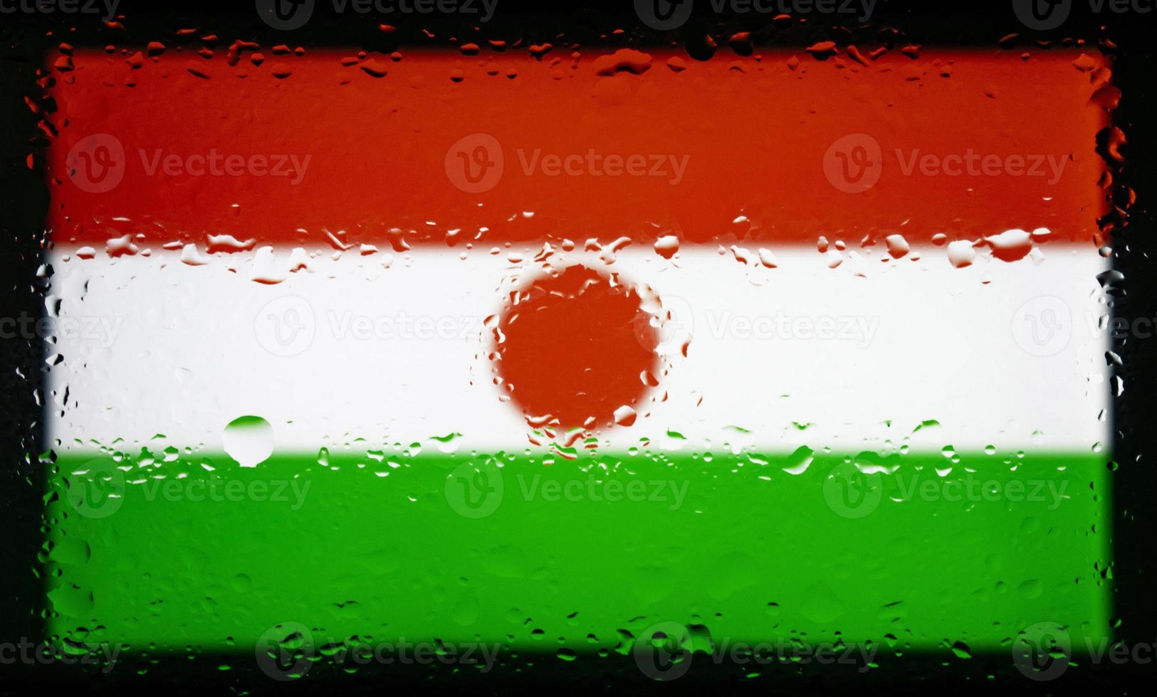 Drops of water on Niger flag background. Shallow depth of field. Selective focus. Toned. photo