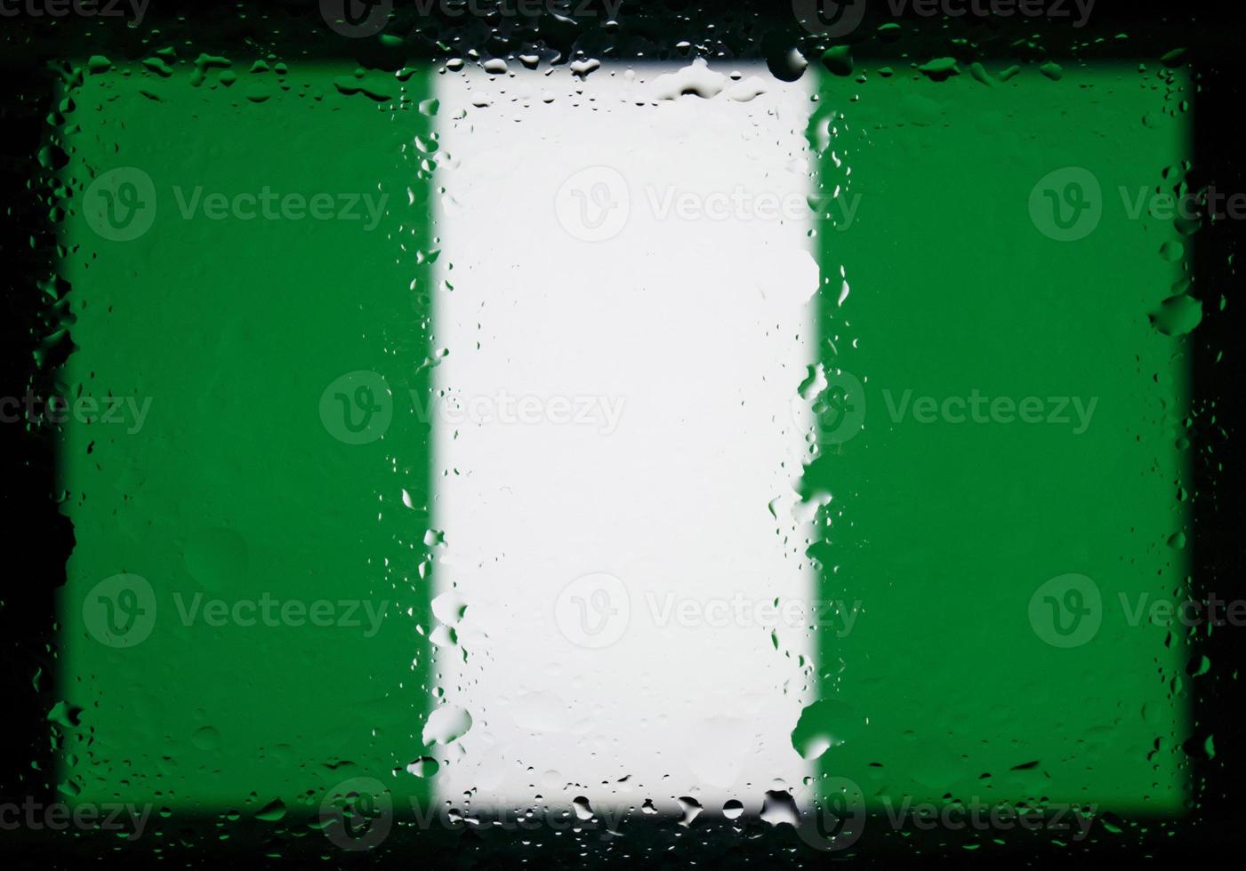 Drops of water on Nigeria flag background. Shallow depth of field. Selective focus. Toned. photo