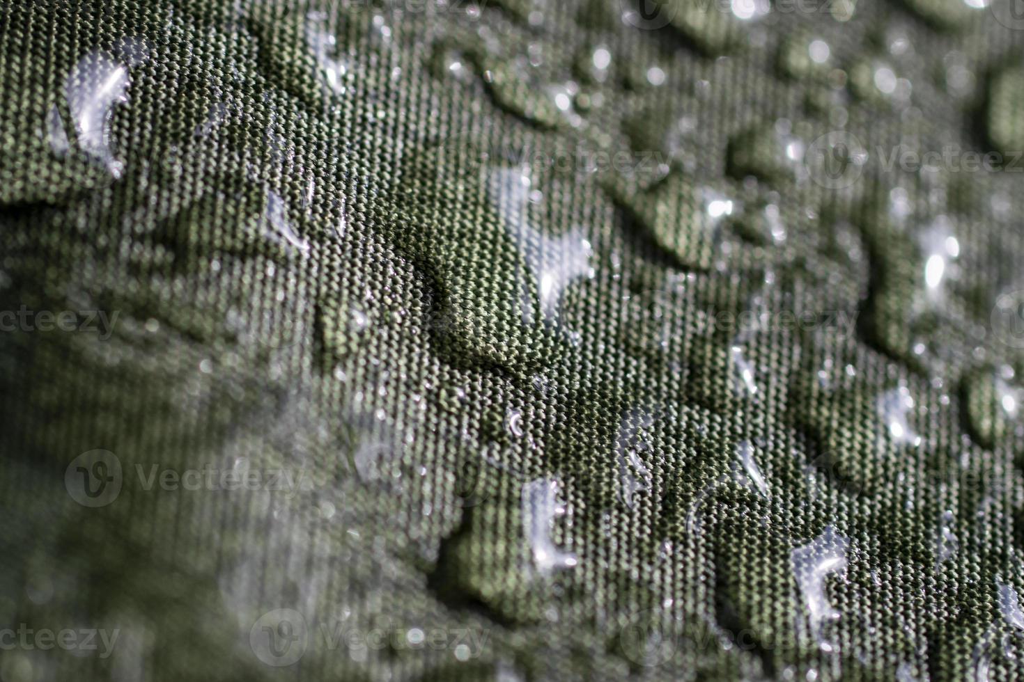 Water drops on the fabric. Water drops on green background. Condensate. Water drops background.Luxury green background photo